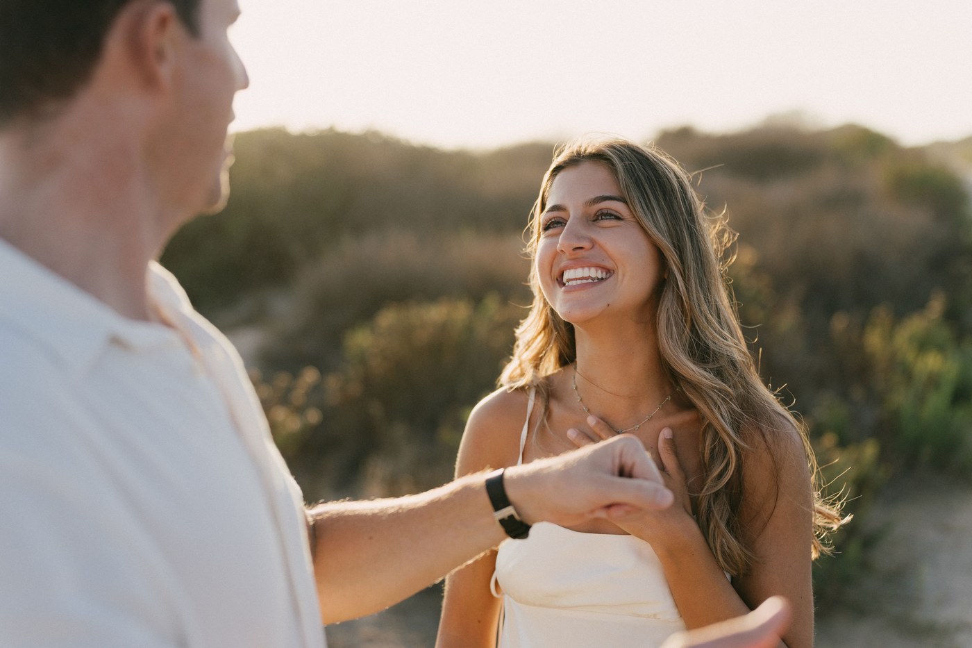 He takes her hand