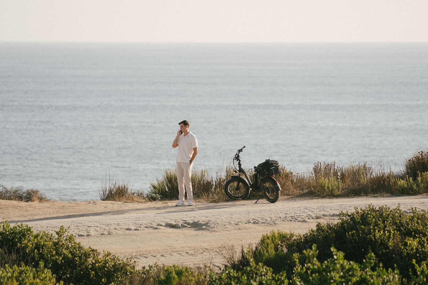 Cameron waiting on the bluff with the bike