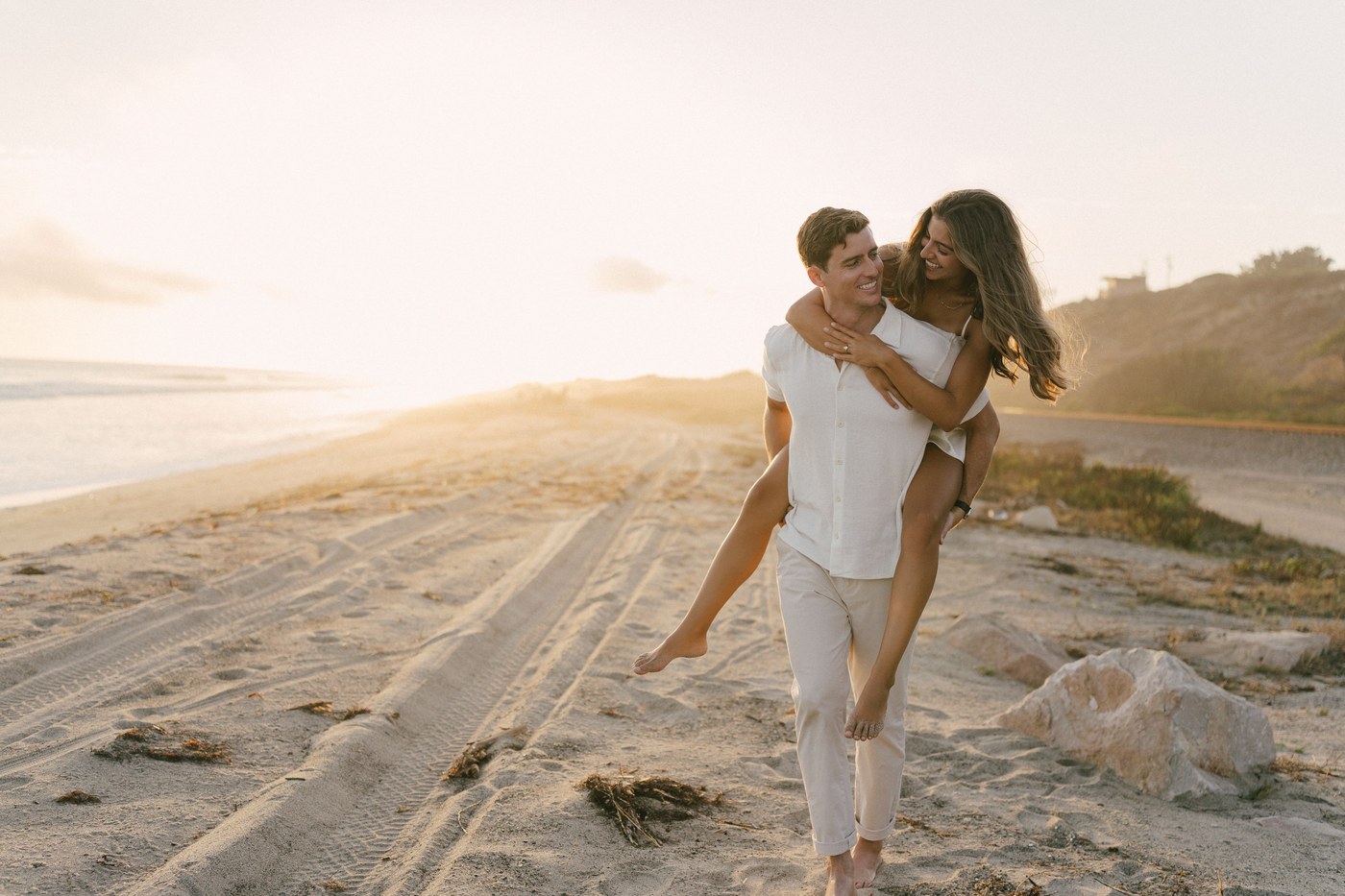 Carrying her down the track towards the beach