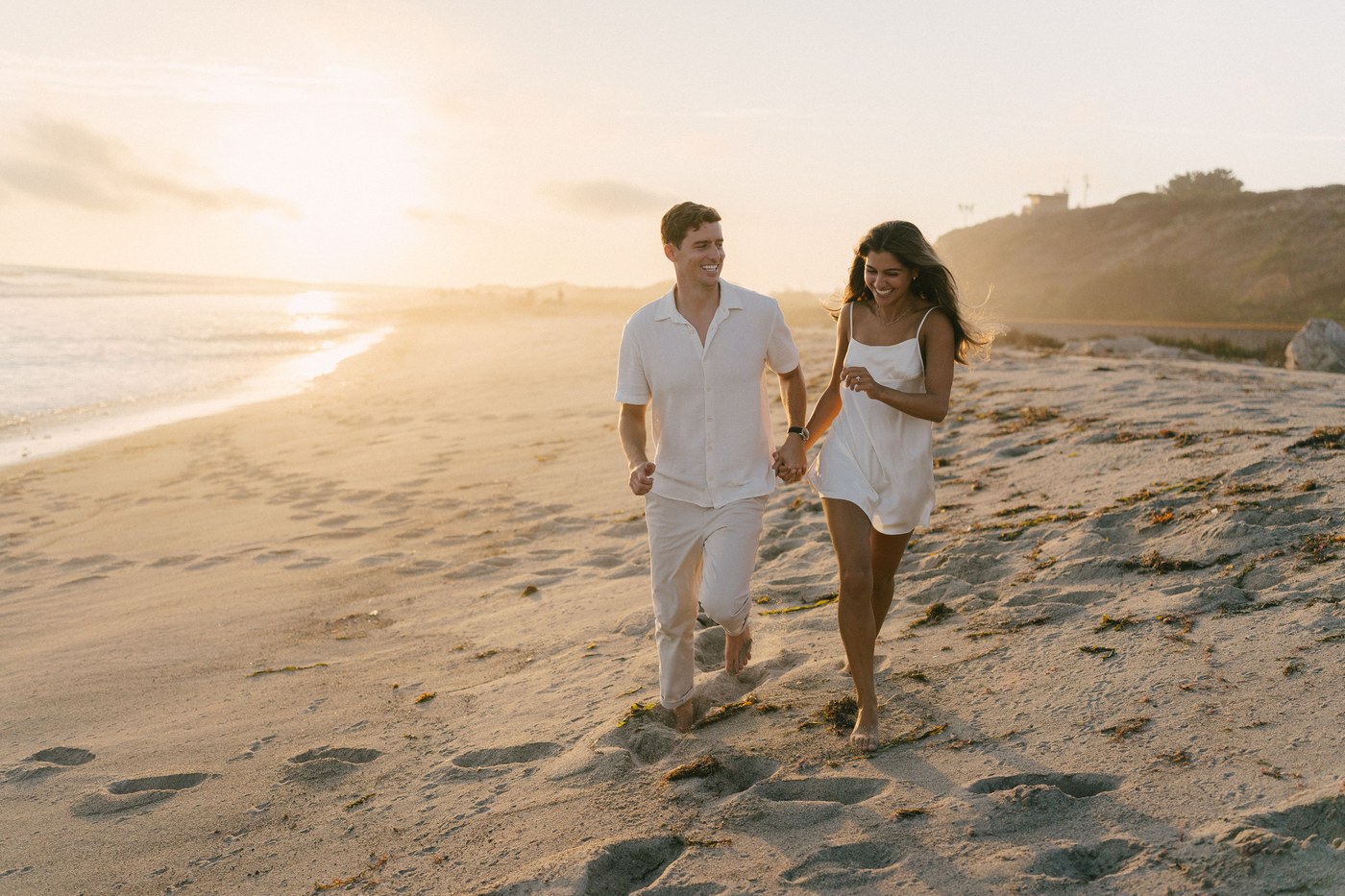 Walking down onto the sand as the sun drops
