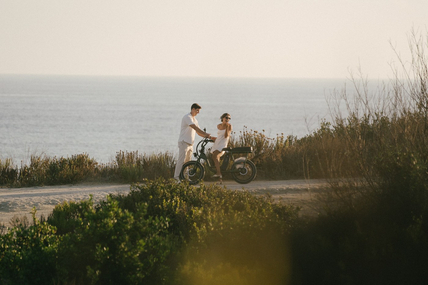 The two of them on the path, the ocean behind