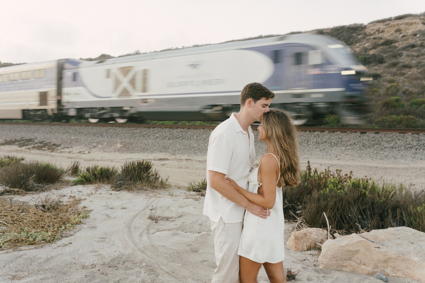 The Surfliner going past behind them