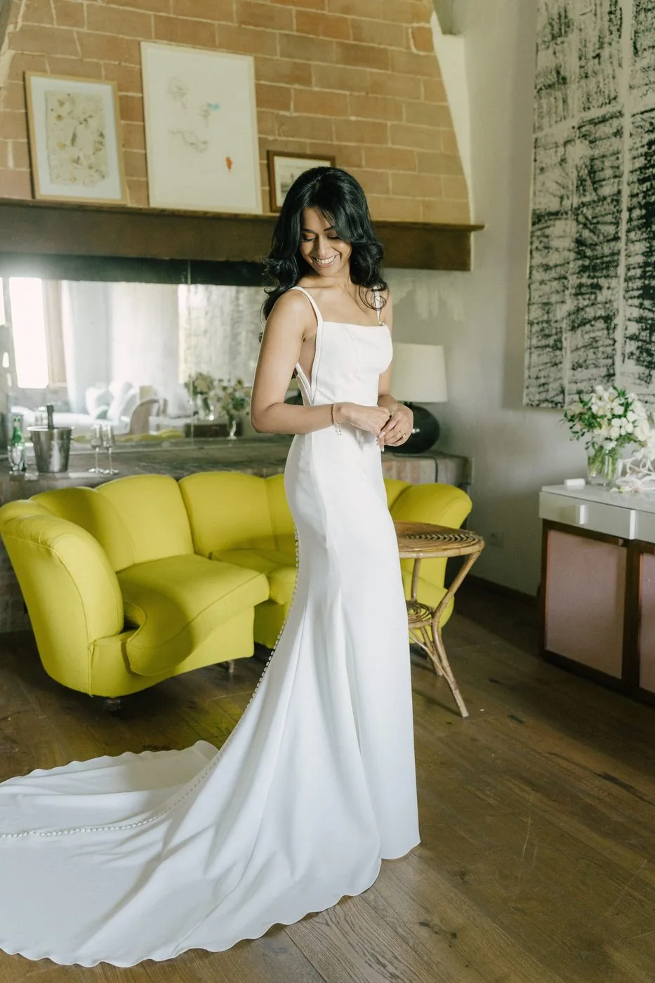 A yellow sofa, and a wedding dress