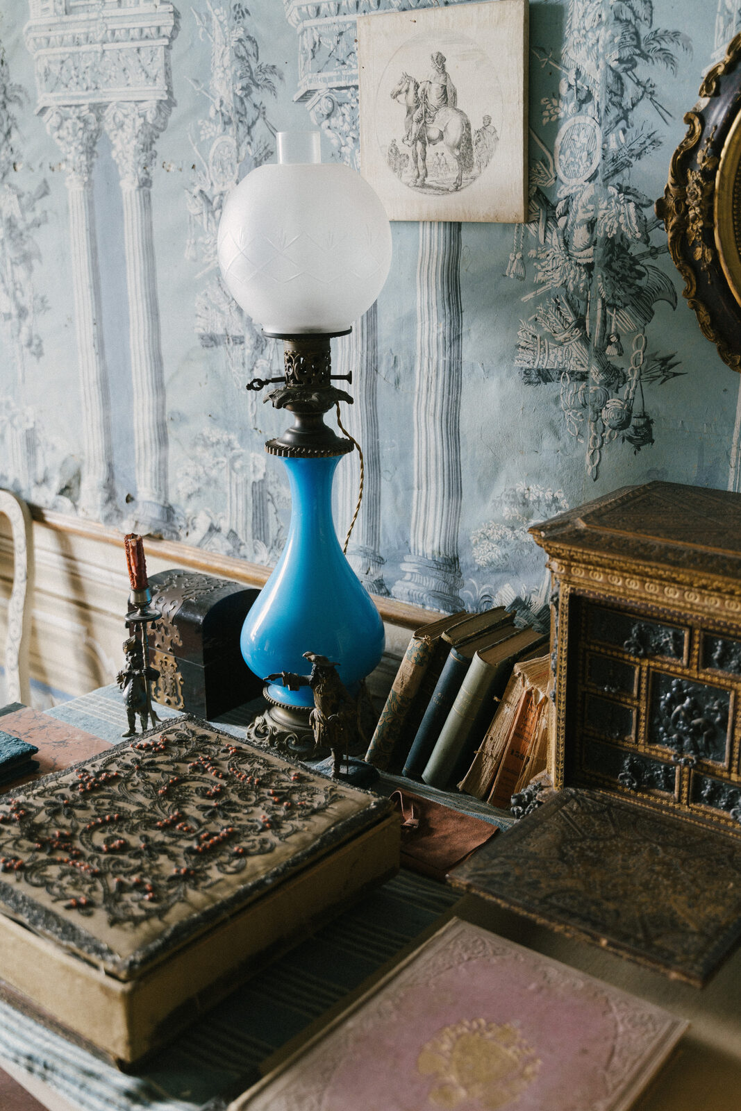 A lamp against the painted panelling