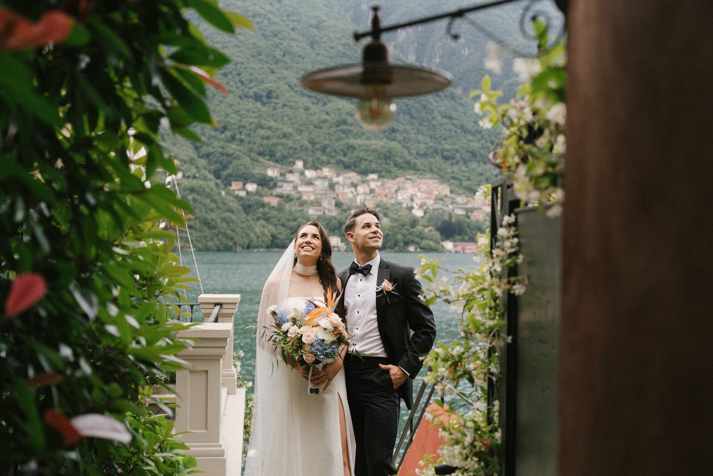 The couple framed by an arch, the lake beyond