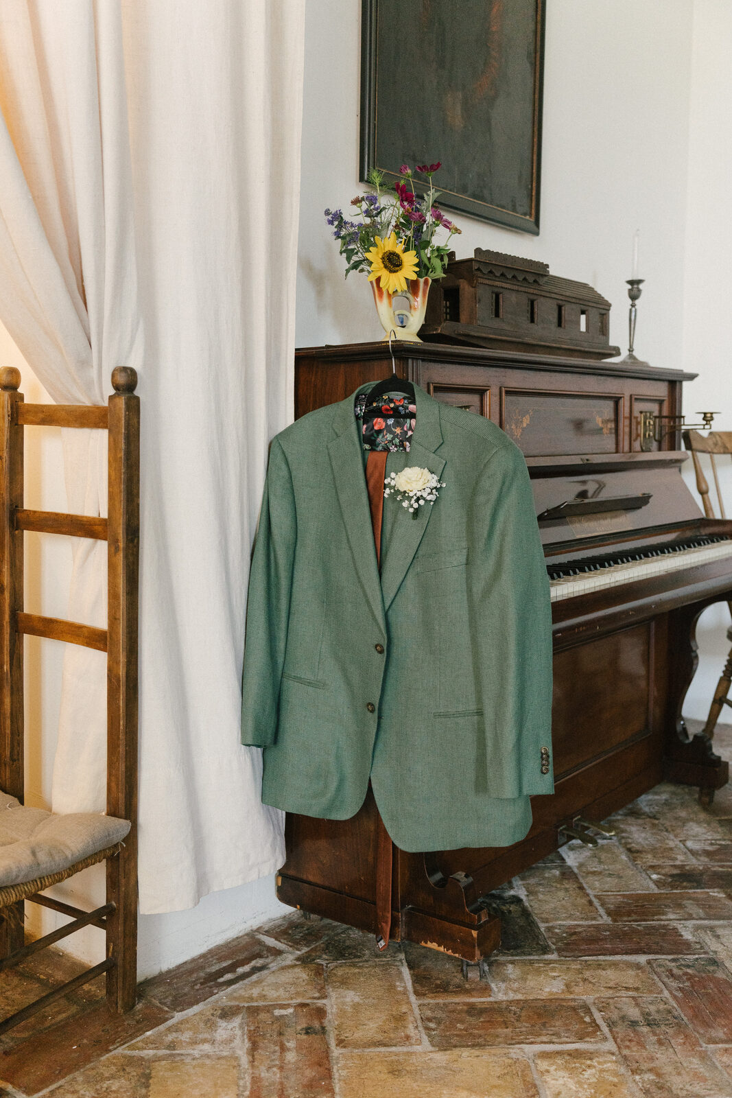 His jacket, on the piano stool