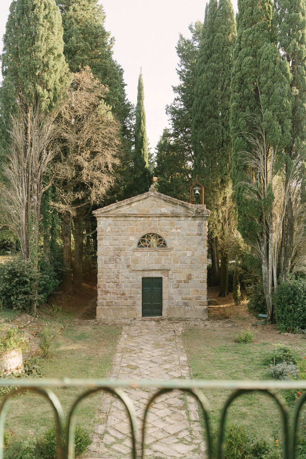 The estate's chapel, at the end of the cypresses