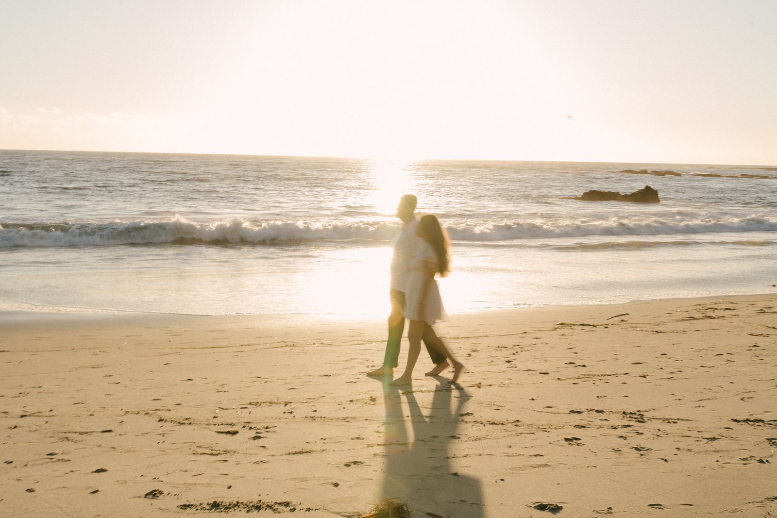 Down on the sand, with the sun going
