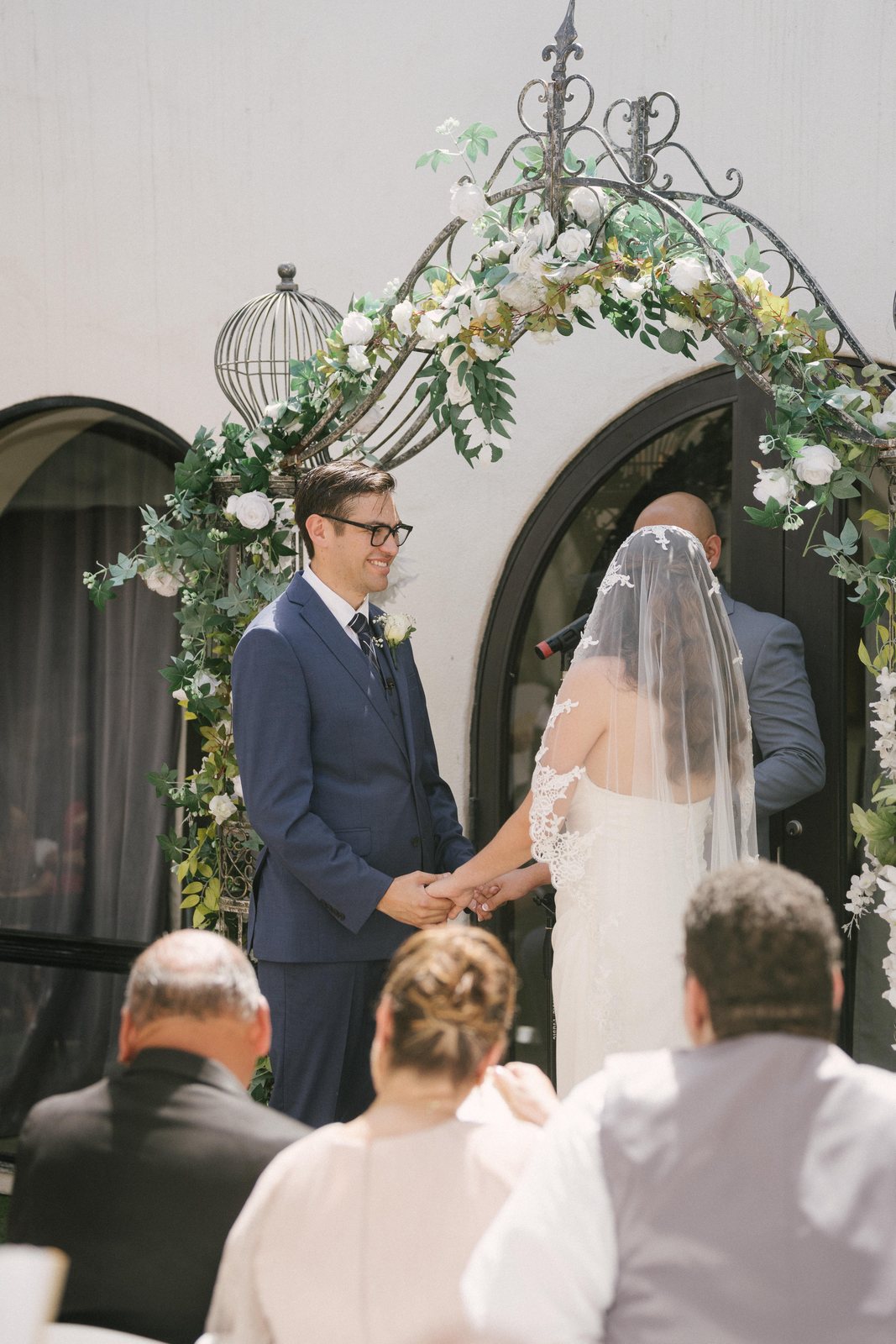 Under the arch of flowers