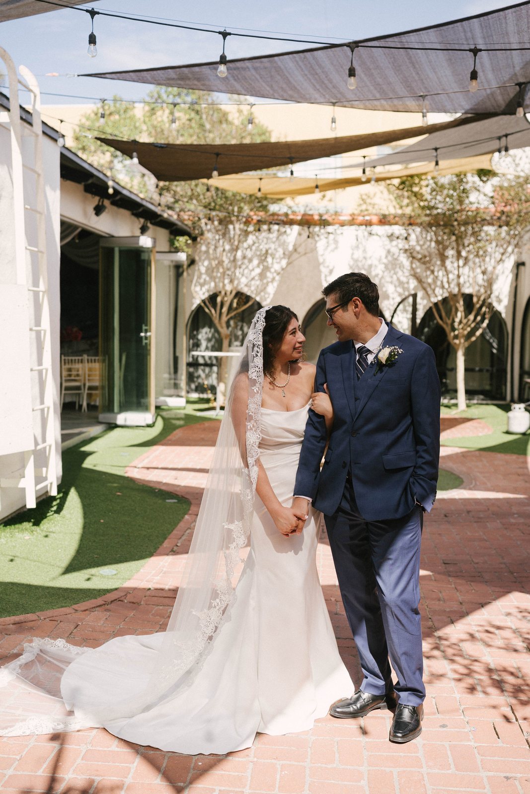The couple in the arcaded courtyard at the Encore Event Center, San Diego, late in the afternoon