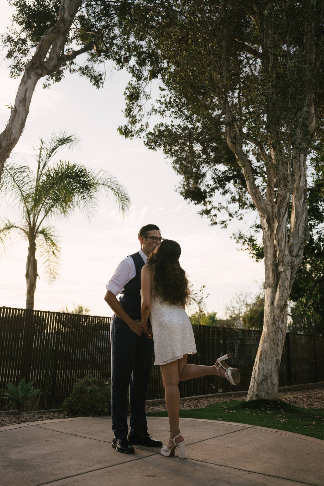 Outside, under the palms