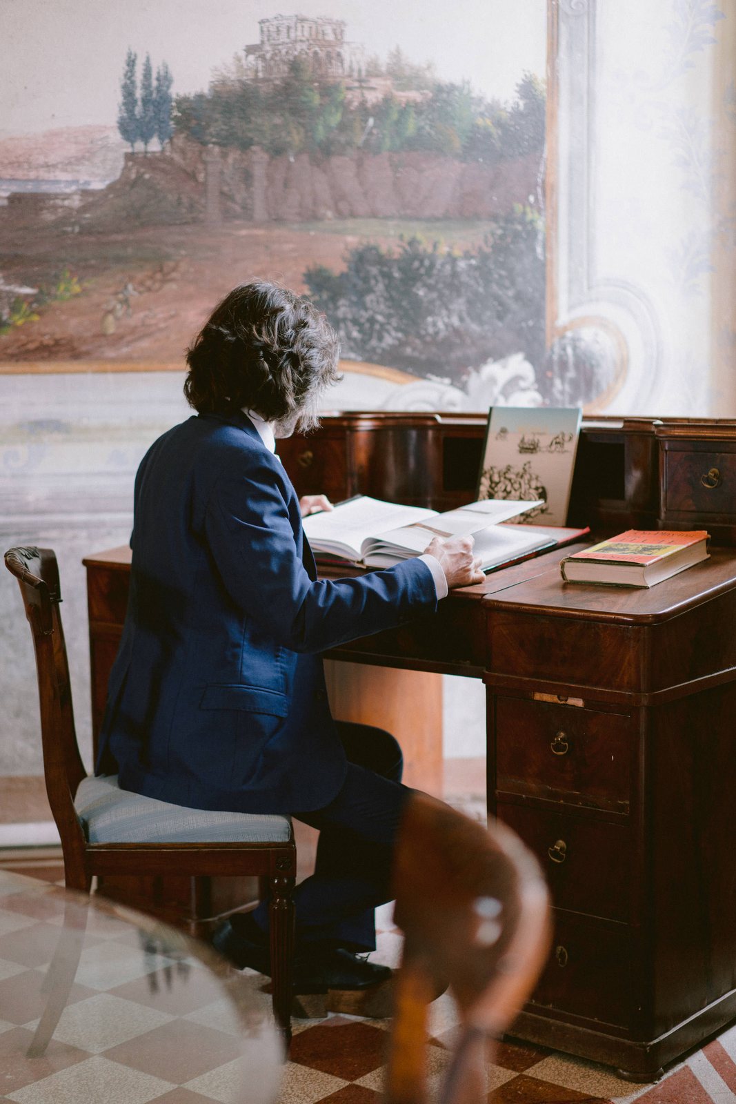 Him, at the writing desk