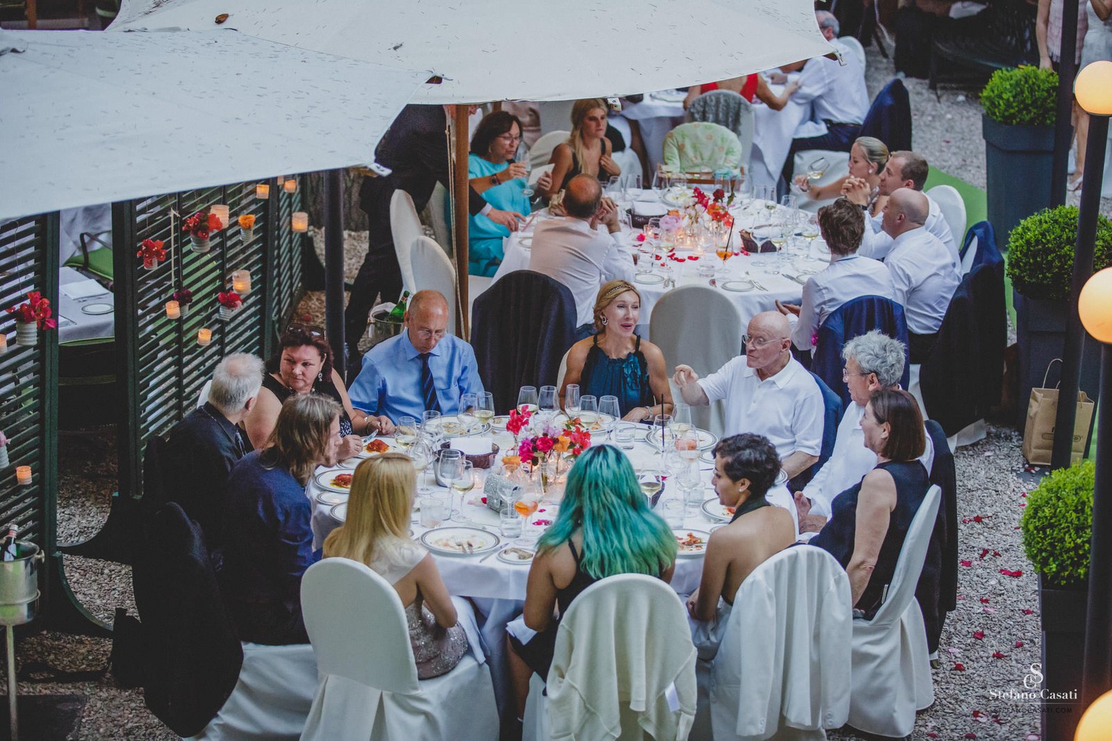 The tables, under the umbrellas