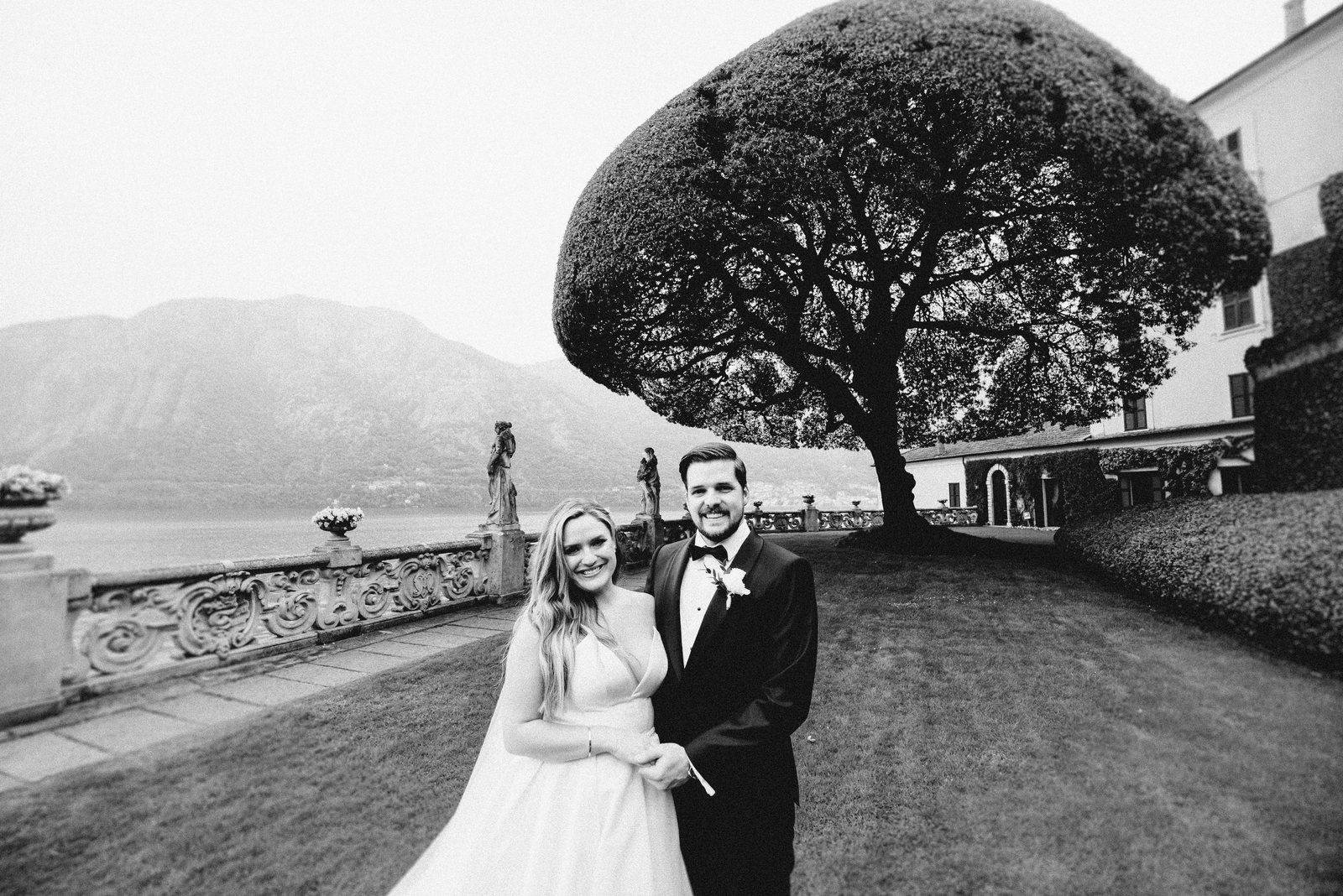 A couple under a tree, in black and white