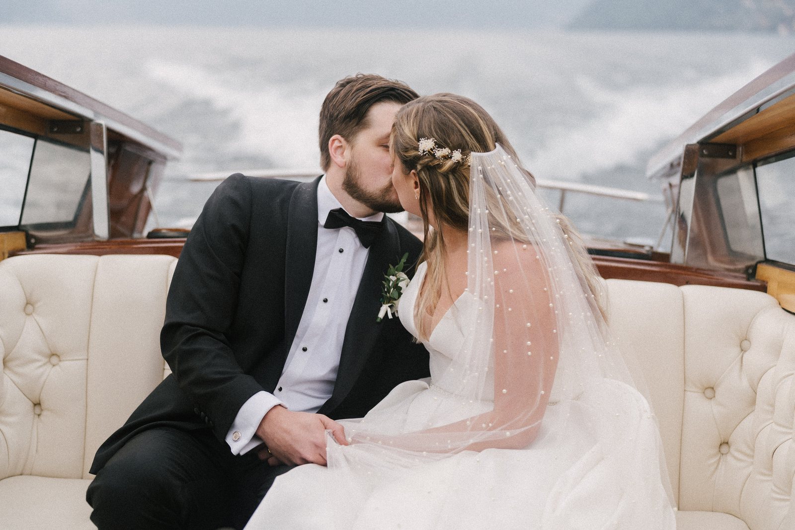 A couple on a boat on Lake Como