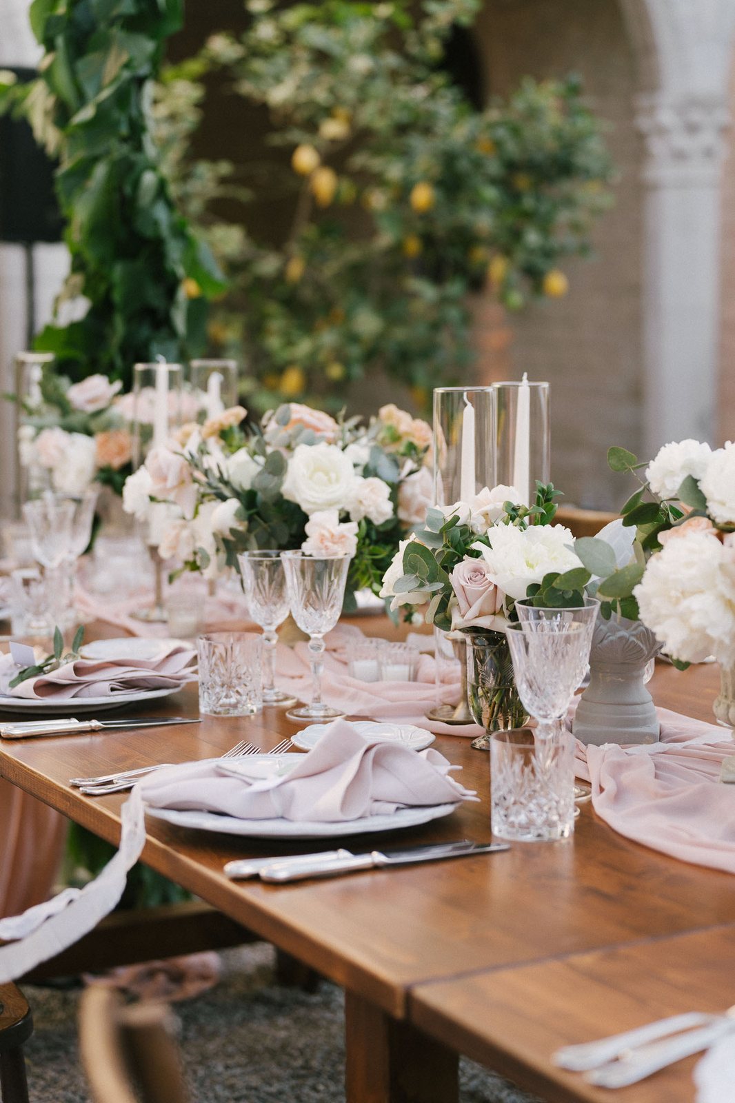 A table laid, in shade — after the preset