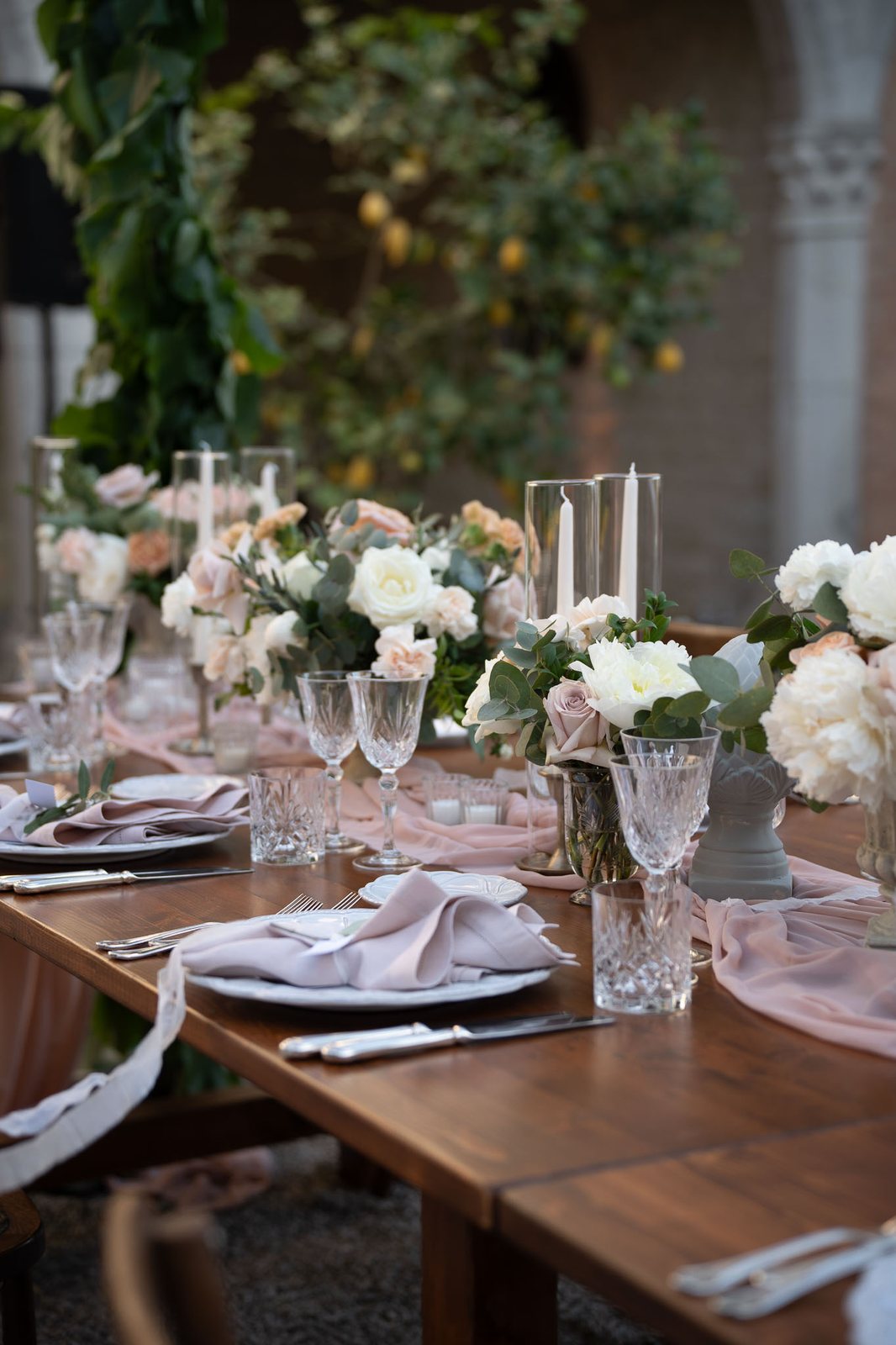 A table laid, in shade — before the preset