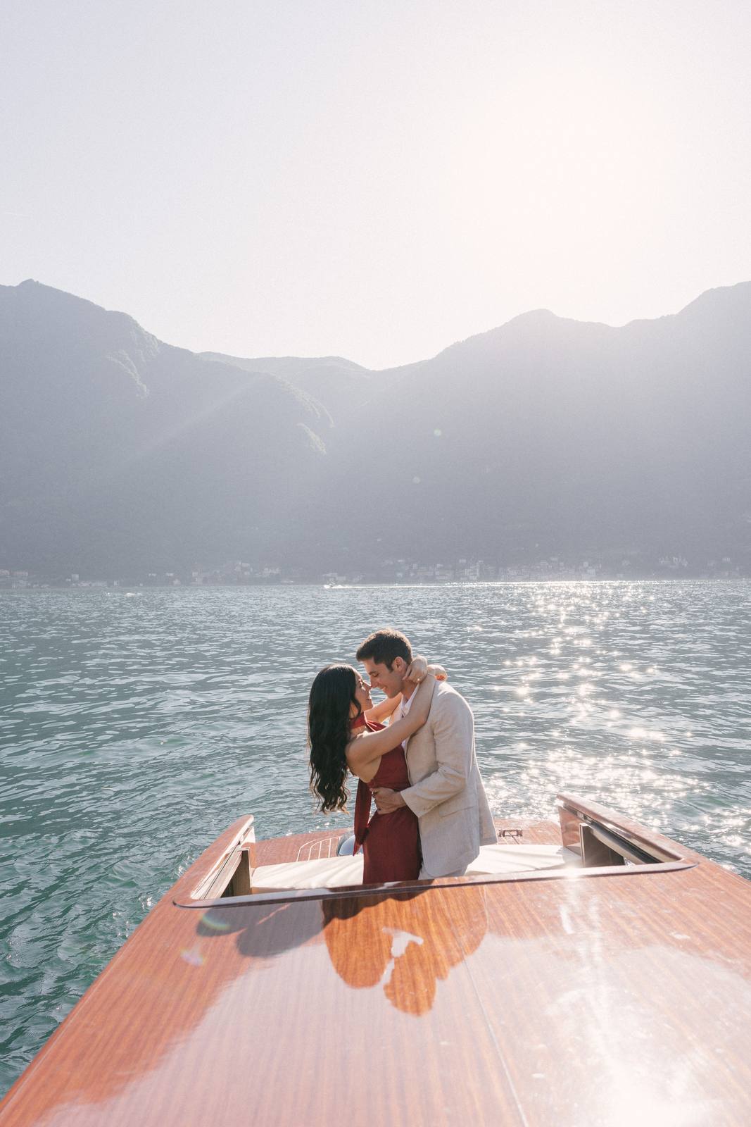 A couple on a boat on Lake Como during a wedding weekend