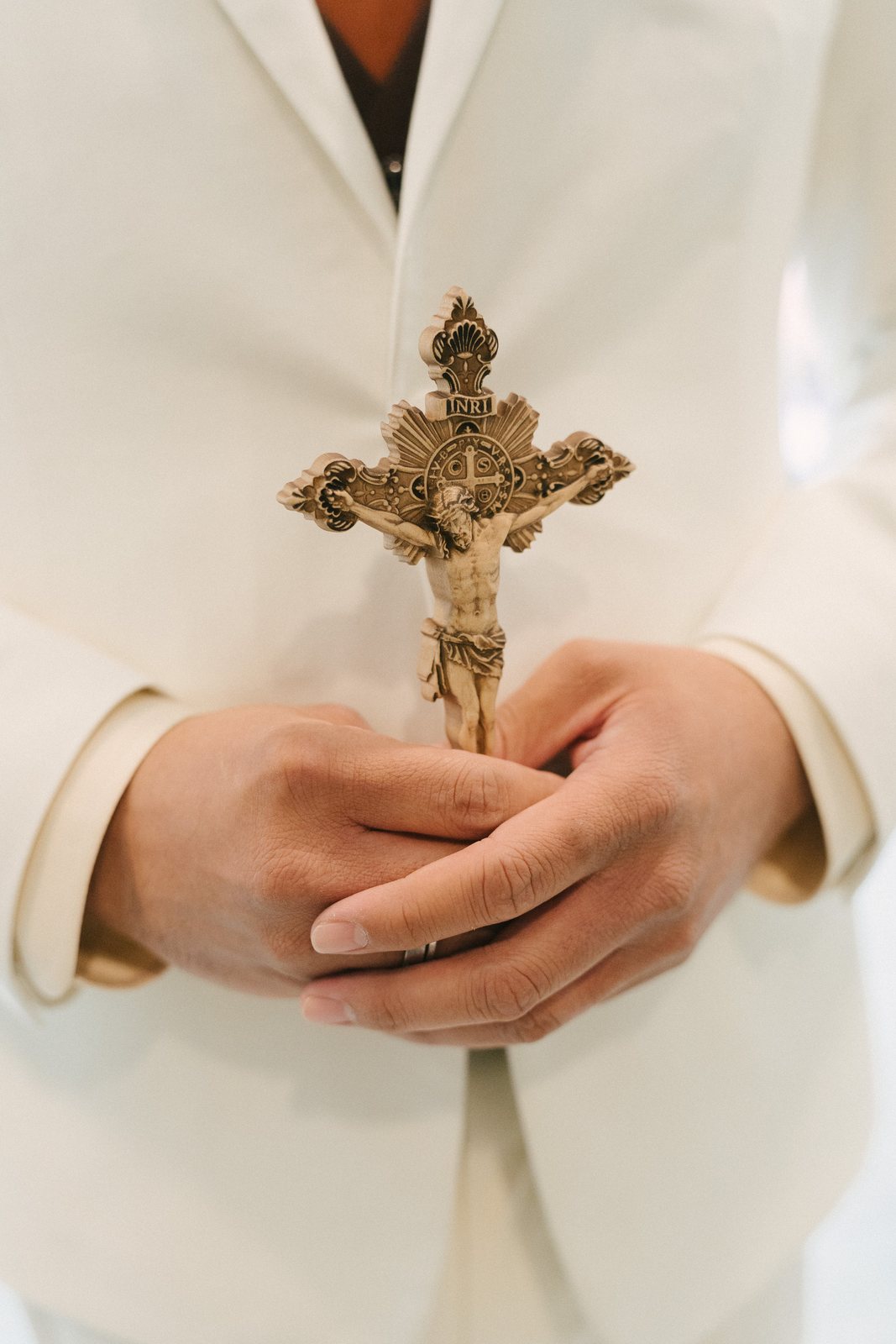 In his hands