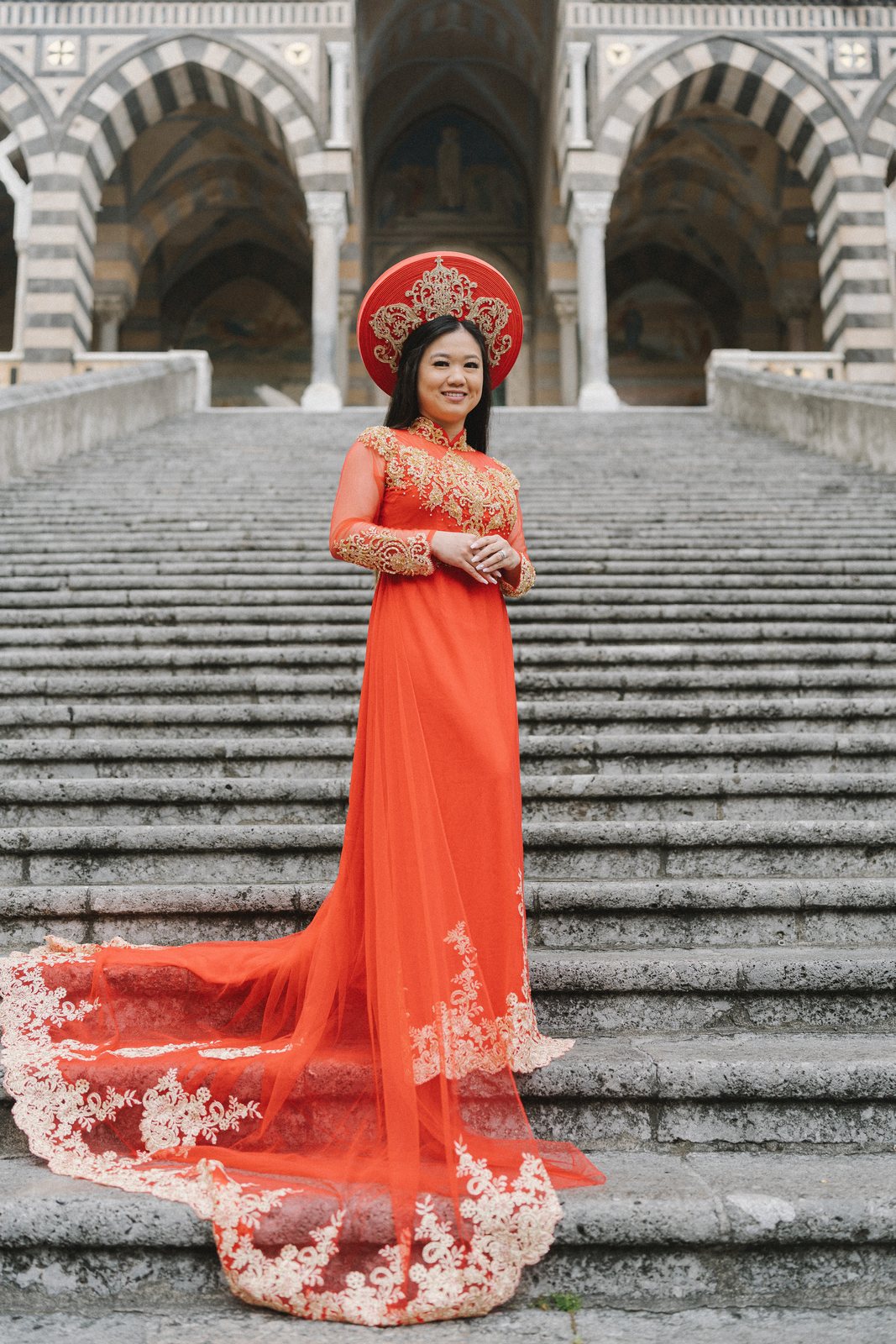 The áo dài, on the cathedral steps