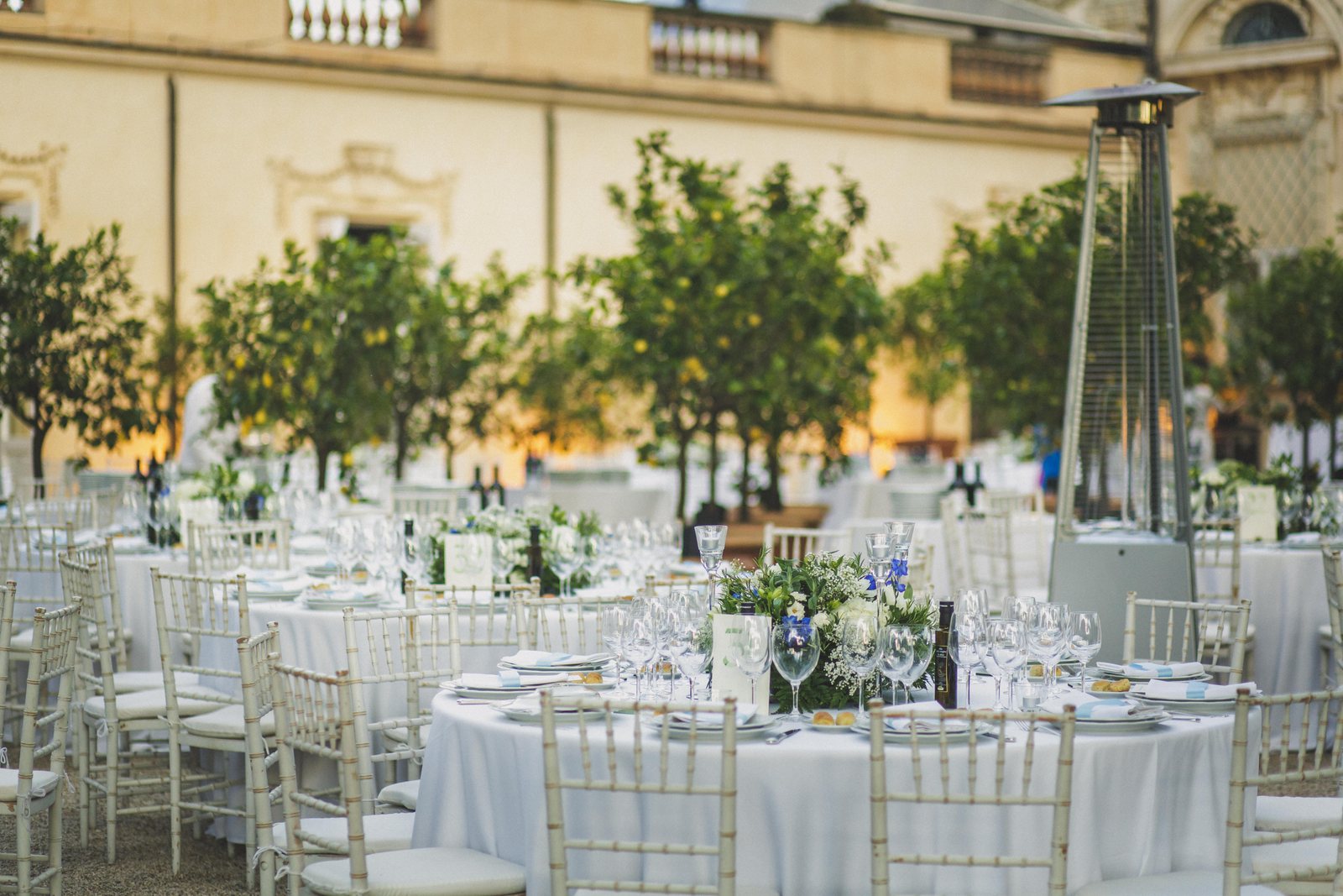 The tables, set under the trees